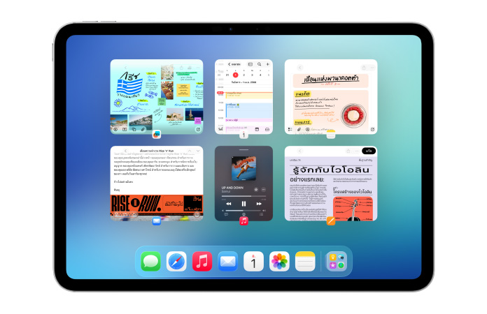 iPad ในแนวนอนแสดงหน้าจอที่มีแอปหลายรายการ เช่น ปฏิทินและเพลง จัดเรียงเป็นหน้าต่าง 6 บานใน 2 แถวอย่างสมดุล