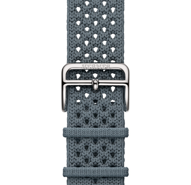 Apple Watch Hermès Series 11 Néo Tricot band, bleu gris colour (blue grey), knit polyamide yarn material, adjustment holes centred, silver colour buckle closure engraved with Hermés
