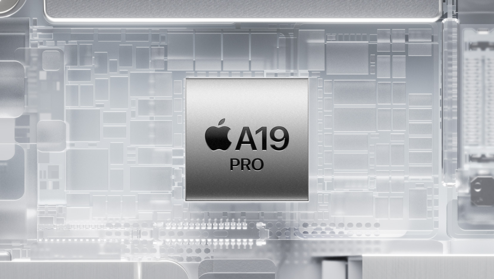 Chip A19 Pro rodeado de componentes brillantes en el interior de un iPhone