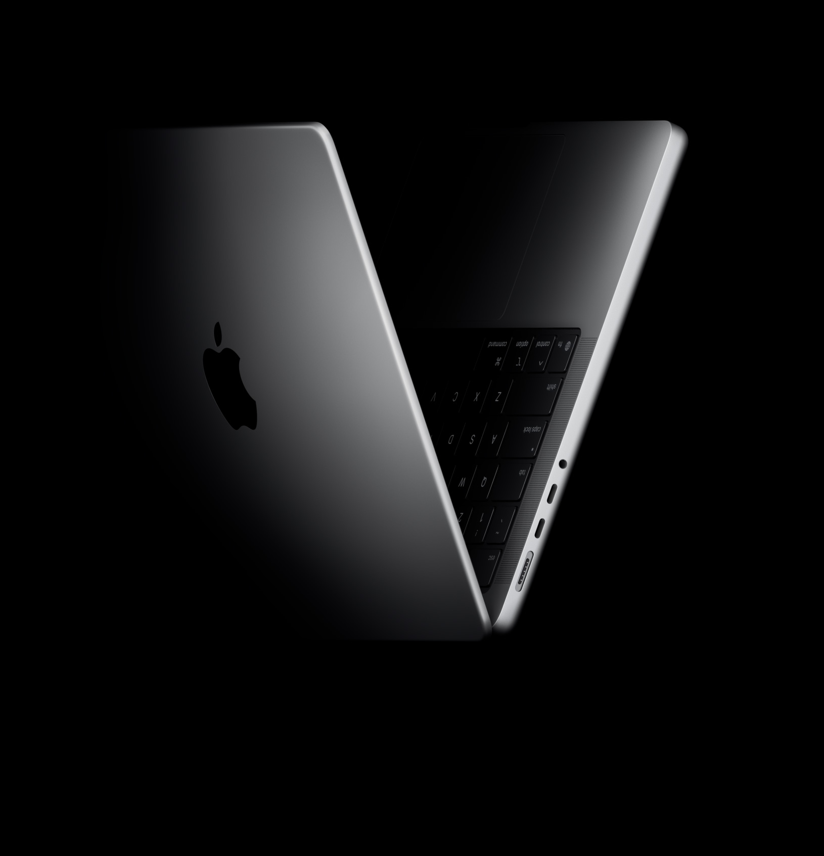 Ein MacBook Pro in einer V-Form, die auf die M5 Chip Familie anspielt
